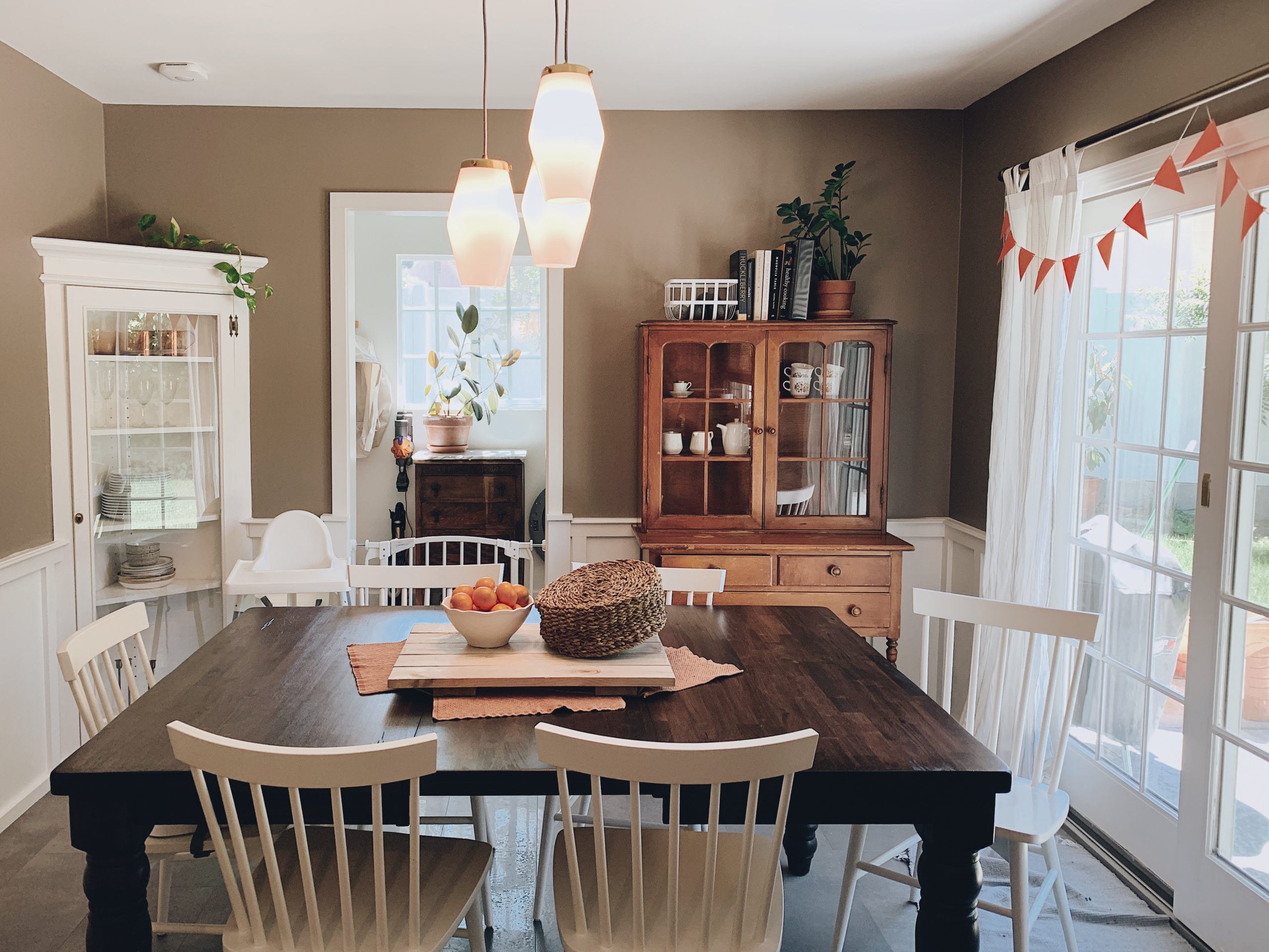 Cozy farmhouse dining room with wooden table and warm fall decor