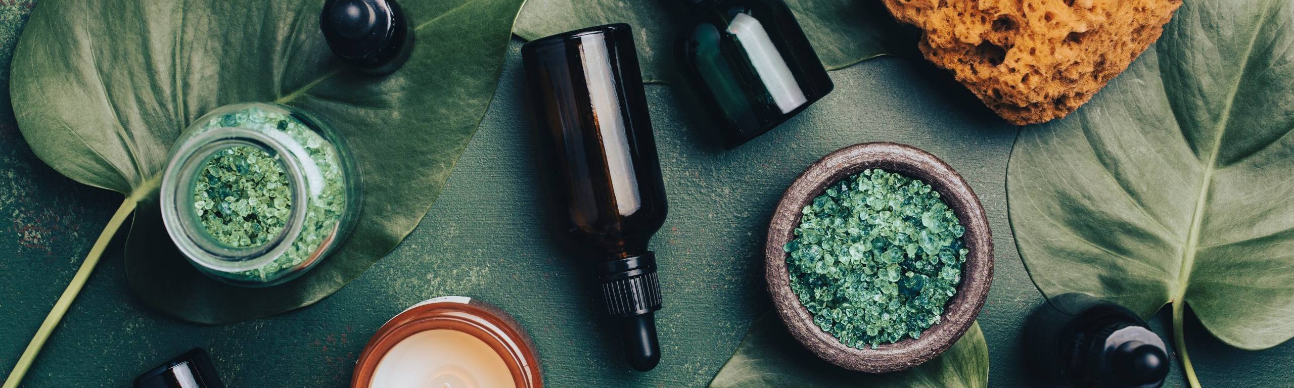 Natural skin care routine at home with zero waste eco friendly hygiene bathroom concept. reusable cosmetic bottles, essential oils droppers, candle
