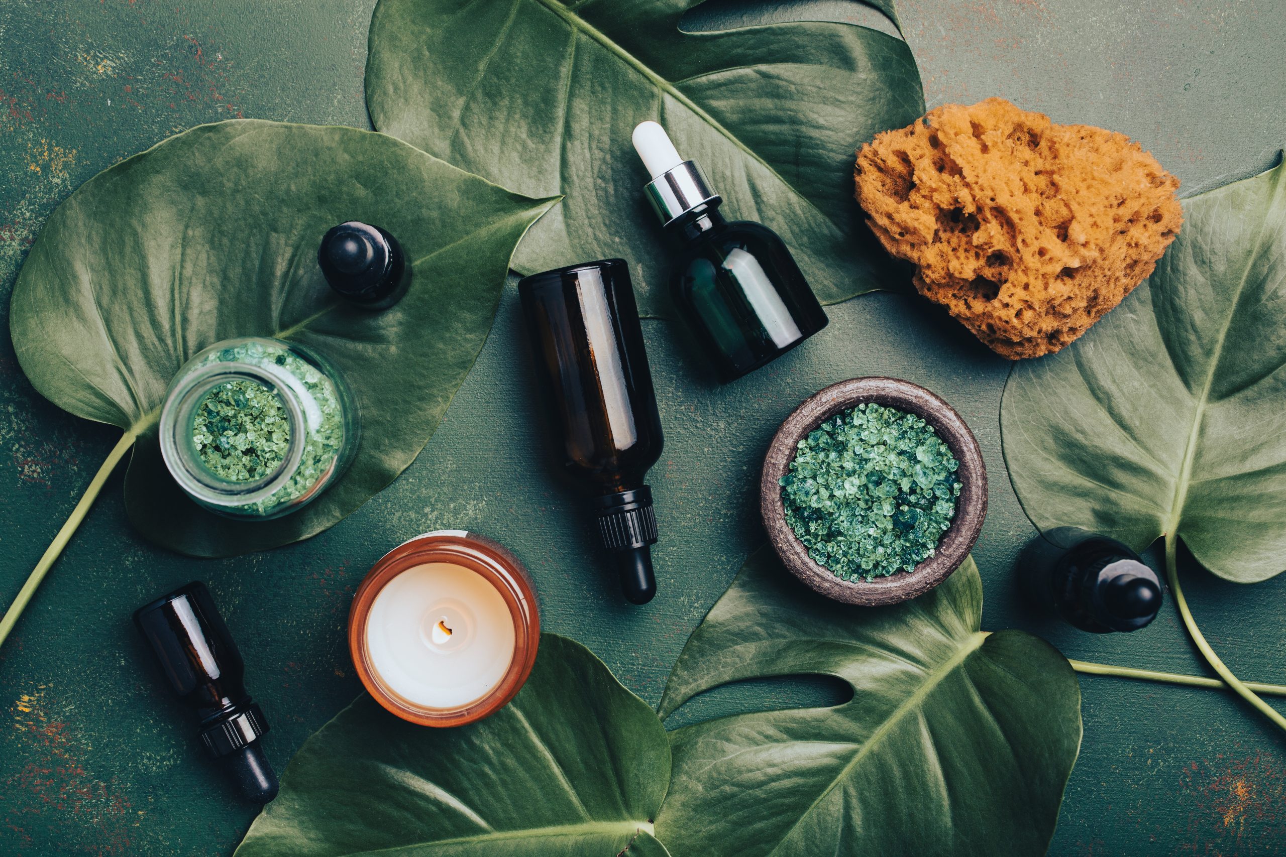 Natural skin care routine at home with zero waste eco friendly hygiene bathroom concept. reusable cosmetic bottles, essential oils droppers, candle