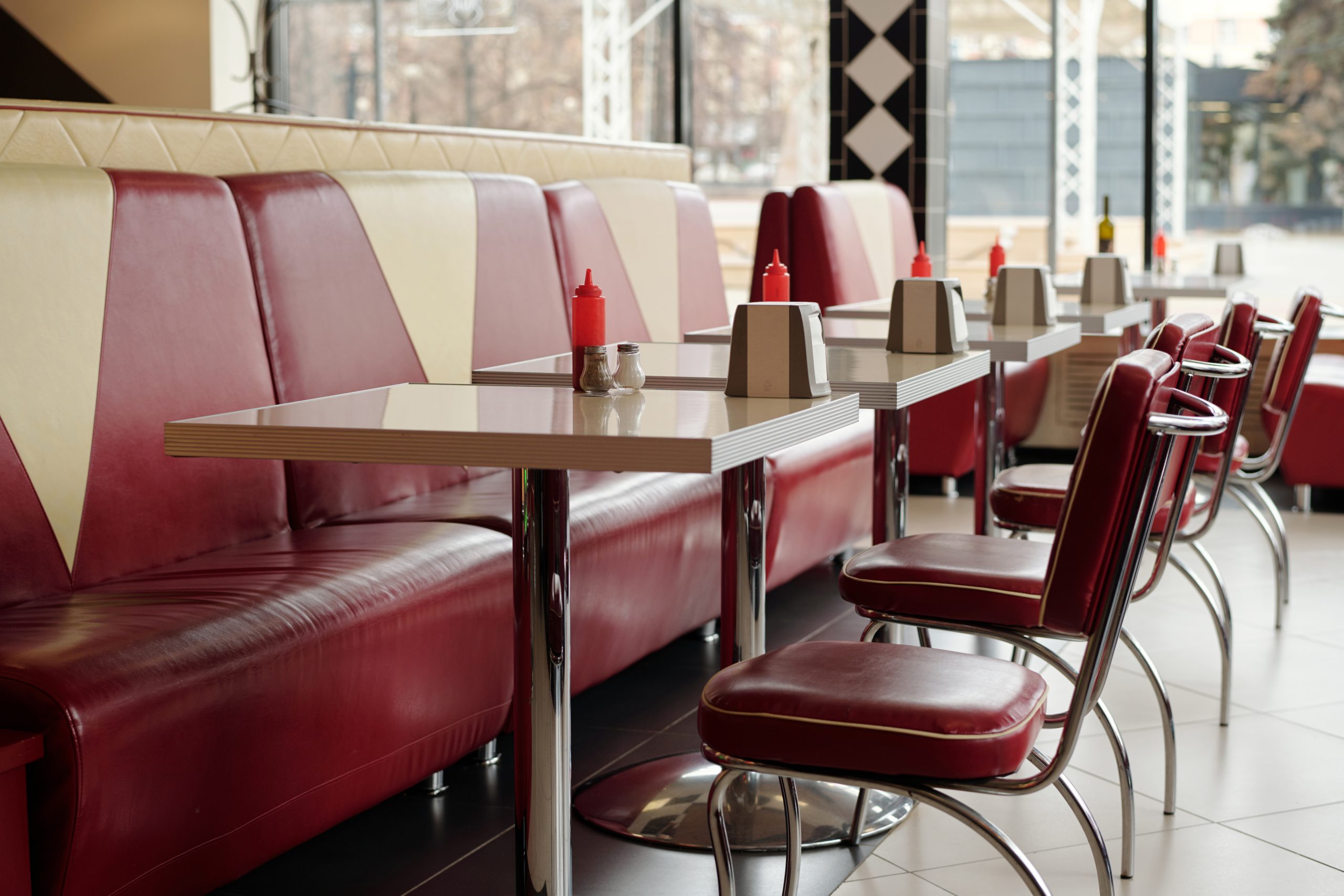Classic American retro diner interior with red vinyl seats and vintage decor along Route 66