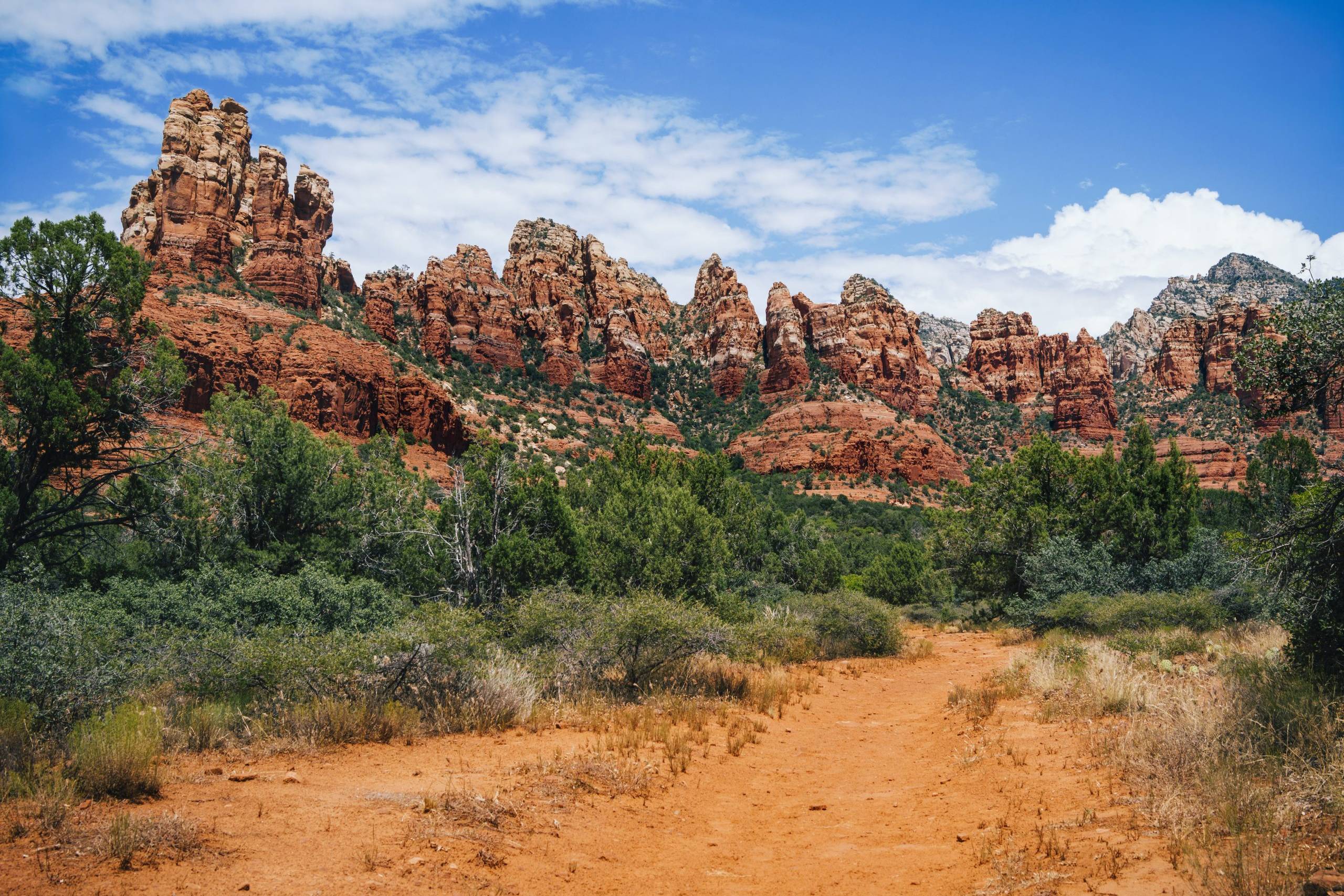Red rock formations and green desert vegetation in Sedona Arizona on a southwest road trip